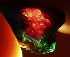 Transmitted light through the tourmaline crystal fragment.